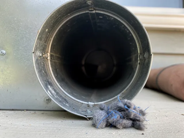 Home Gardens Dryer Vent Cleaning technician using specialized equipment to clear severe dryer vent blockage in Home Gardens